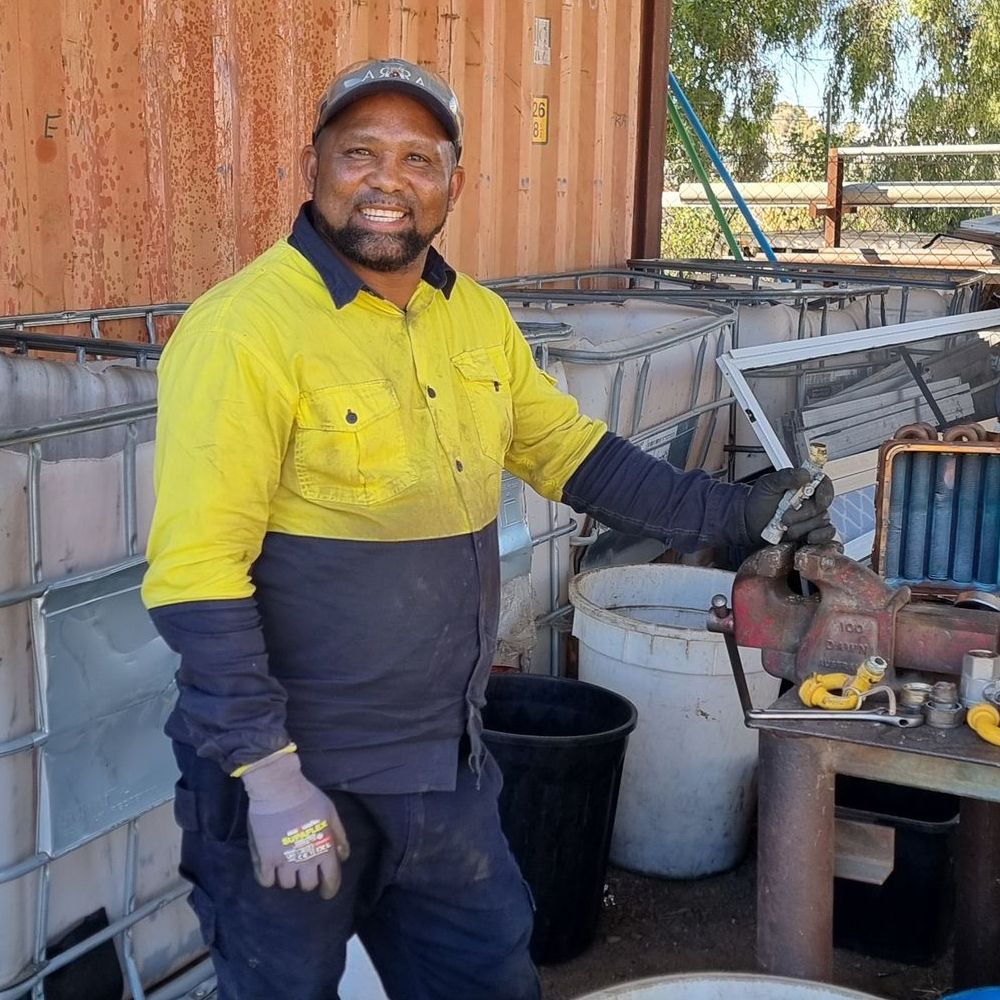 A Group of Construction Workers Are Working on a Brick Wall — Beehive Property Maintenance in Emerald, QLD