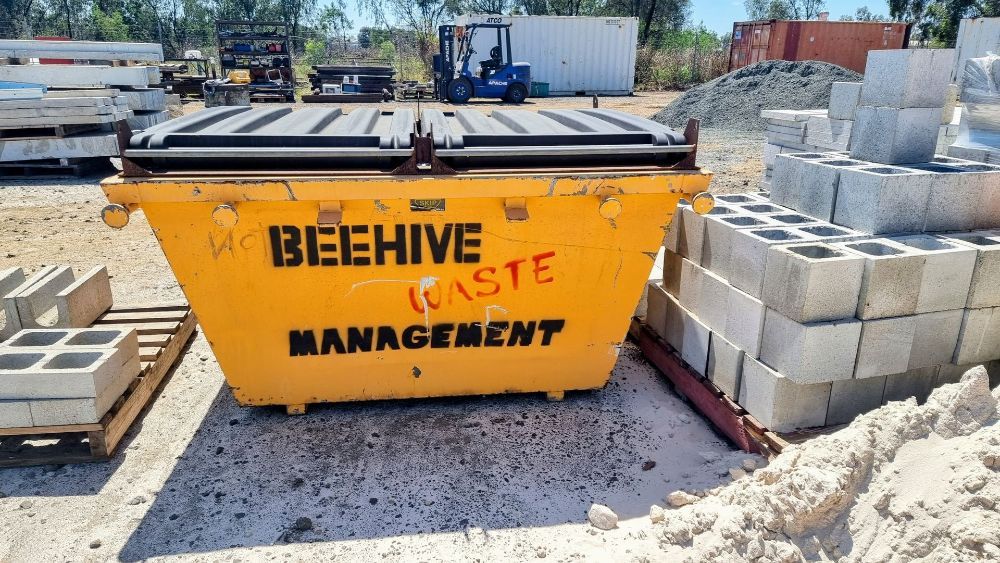 A Pile of Red Mulch is Sitting on the Ground — Beehive Property Maintenance in Dysart, QLD