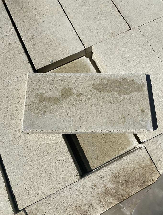 A Brick is Sitting on Top of a Pile of Bricks — Beehive Property Maintenance in Comet, QLD