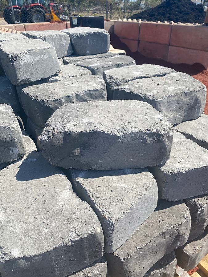 A Pile of Concrete Blocks Stacked on Top of Each Other — Beehive Property Maintenance in Middlemount, QLD