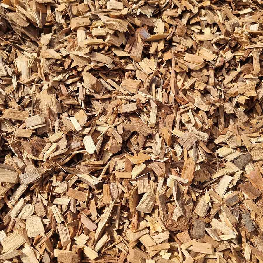 A Pile of Wood Chips is Sitting on the Ground — Beehive Property Maintenance in Emerald, QLD