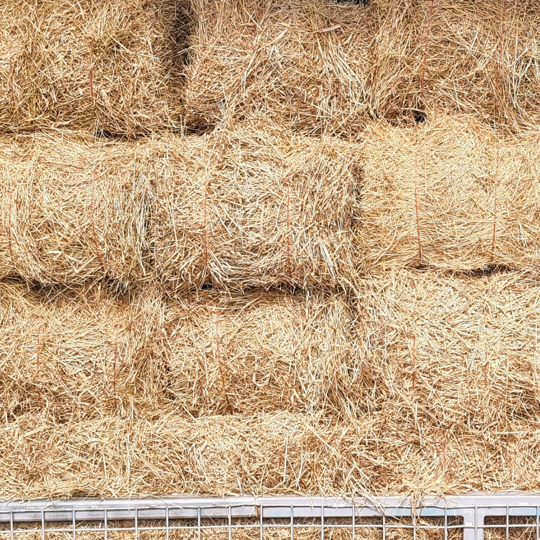 Bunch of Hay Bales Stacked on Top of Each Other on a Wall — Beehive Property Maintenance in Emerald, QLD