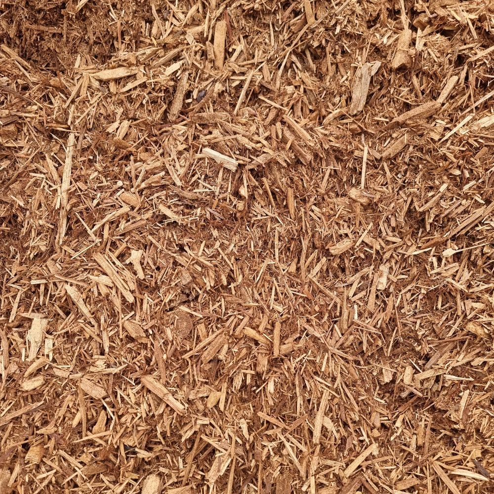 A Tractor is Driving Past a Pile of Mulch — Beehive Property Maintenance in Emerald, QLD