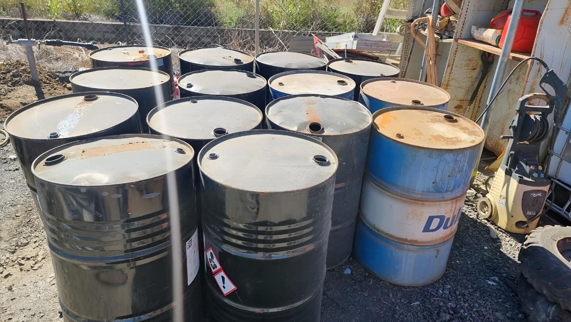 Bunch of Barrels Are Stacked on Top of Each Other — Beehive Property Maintenance in Comet, QLD