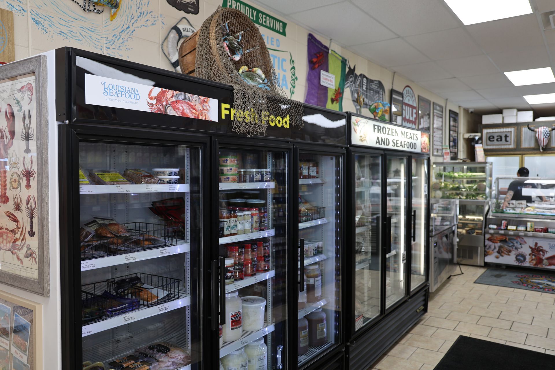 A grocery store with a lot of refrigerators and shelves