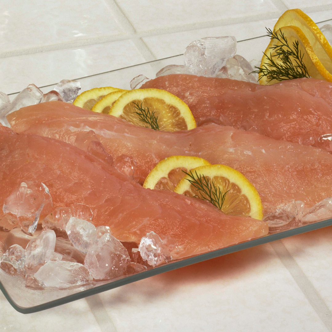 A plate of food with ice and lemon slices on it