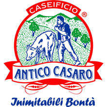 Logo with farmer and cow in a pasture. 
