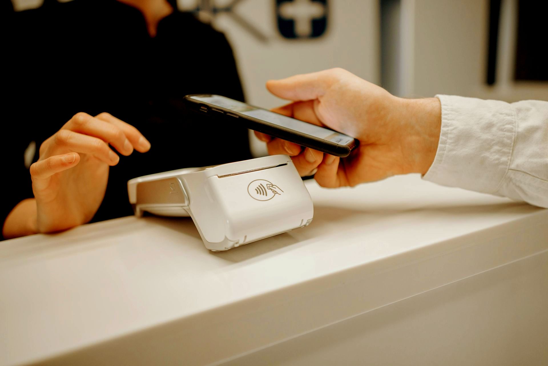 A person is using a smart phone to pay for something.