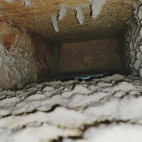 A close up of a hole in the ceiling of a building.