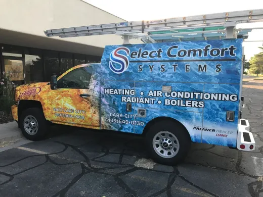 A heating cooling truck is parked in the snow