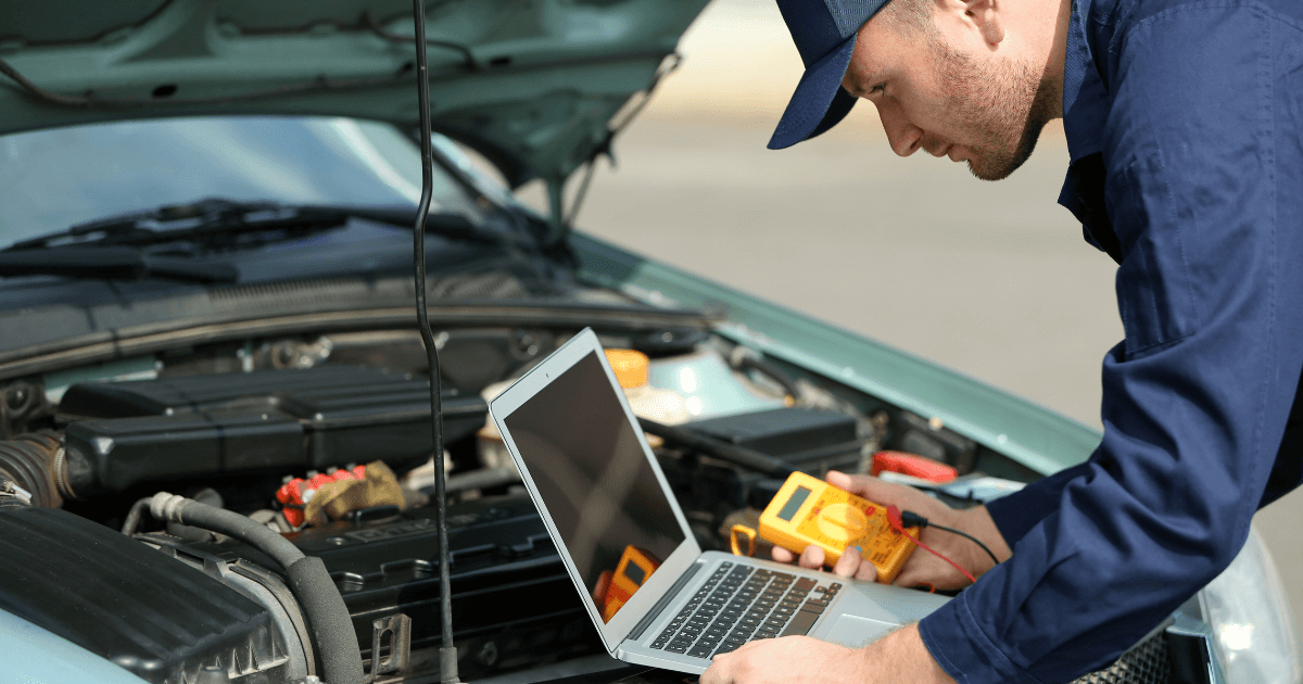 a mechanic doing a vehicle diagnostic evaluation
