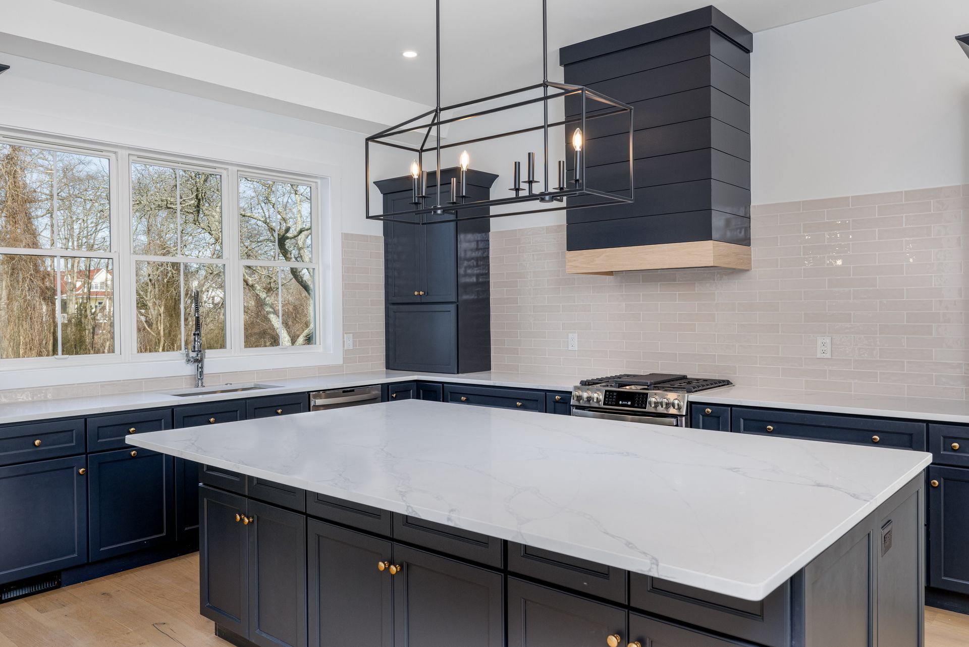 There is a large island in the middle of the kitchen.