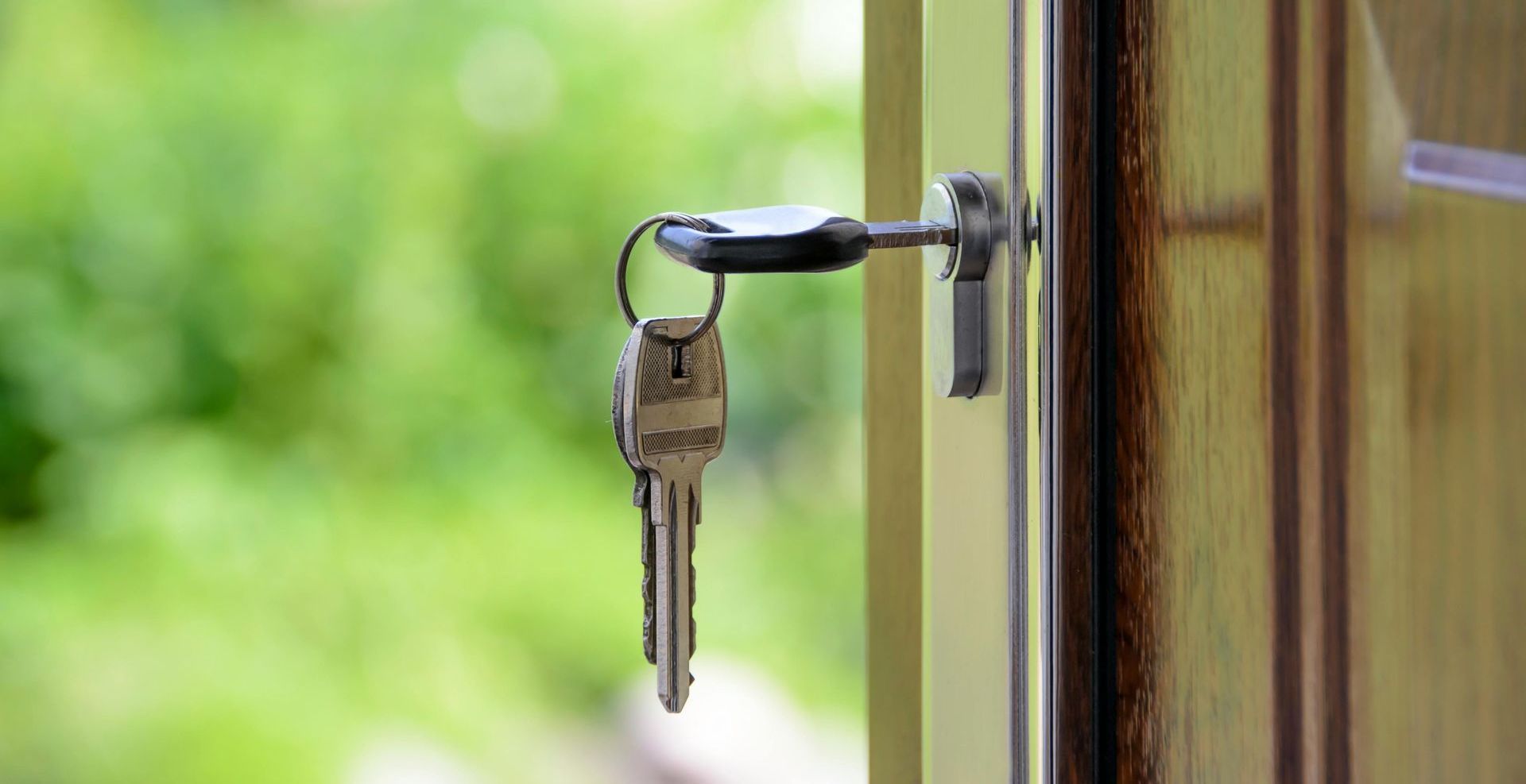 A close up of a key in a door lock.