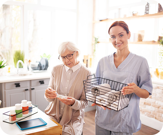 A nurse is helping an elderly woman with her medication.