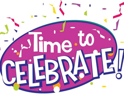 A group of people are raising their hands in the air.