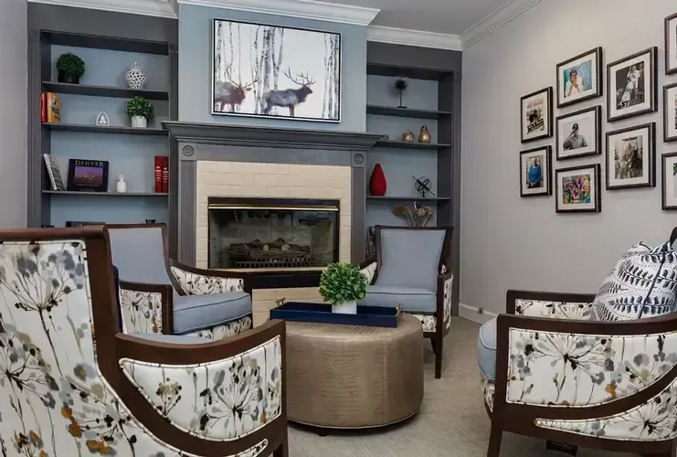 A living room filled with furniture and a fireplace.