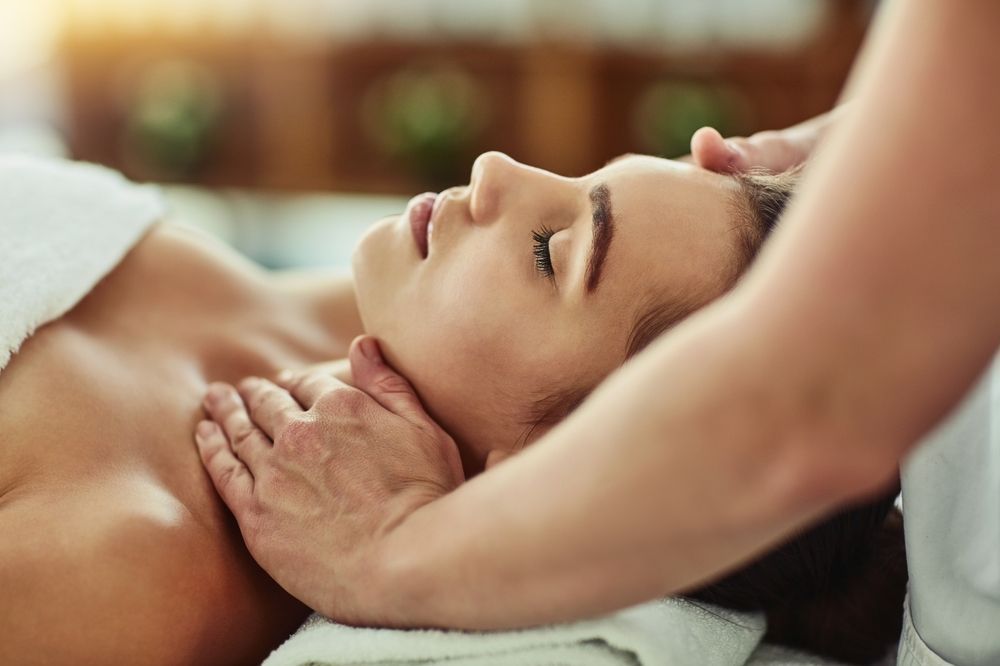 A woman is getting a massage at a spa.