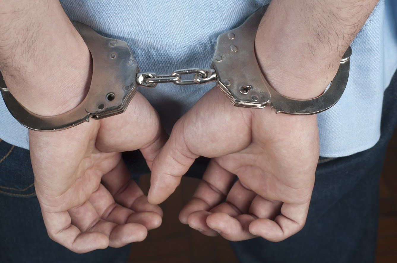 Man in Handcuffs — Pensacola / Milton Florida — Matt Mckeehan Bail Bonds