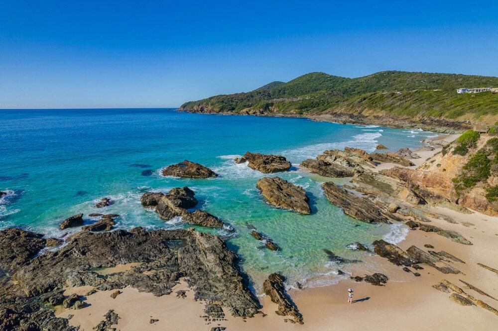 An Aerial View of a River and a Sandy Island in the Middle of the Ocean — Abode Shutters & Blinds In Forster & Tuncurry, NSW