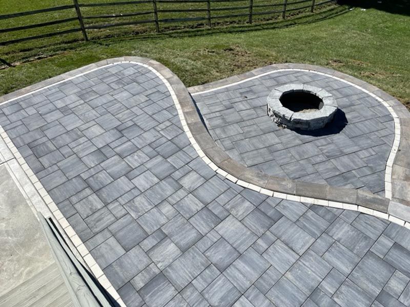 There is a fire pit in the middle of the patio.