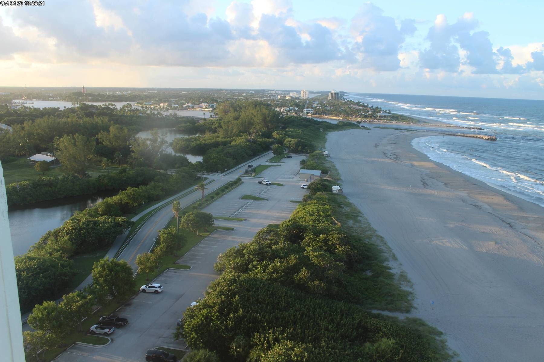 An aerial view of a beach and a parking lot