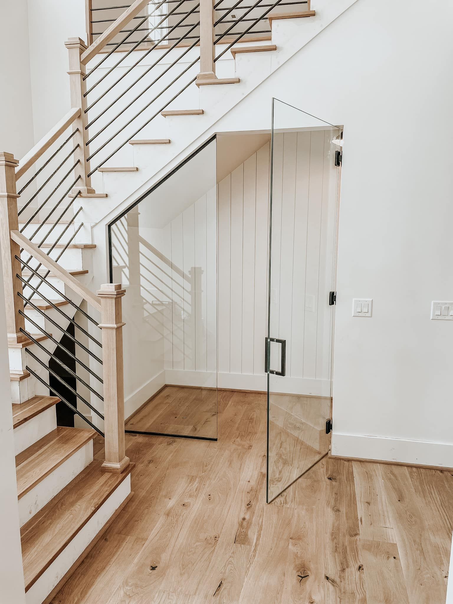 A Staircase with a Glass Door