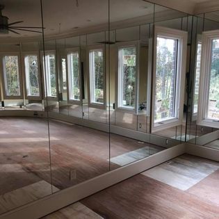 A Large Room with a Lot of Mirrors and Windows | Clayton, NC | Clayton Glass & Mirror