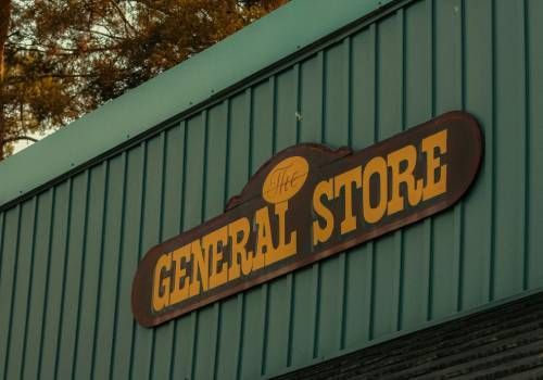 A sign of a local general store.