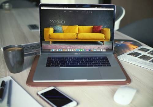 A laptop showcasing a furniture product.