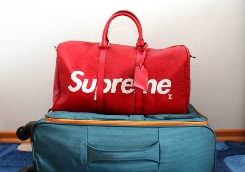 Two bags, one hand carry and one suitcase.
