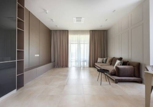 A single room with brown furniture accents.