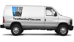 A white van with twomenandvan.com written on the side