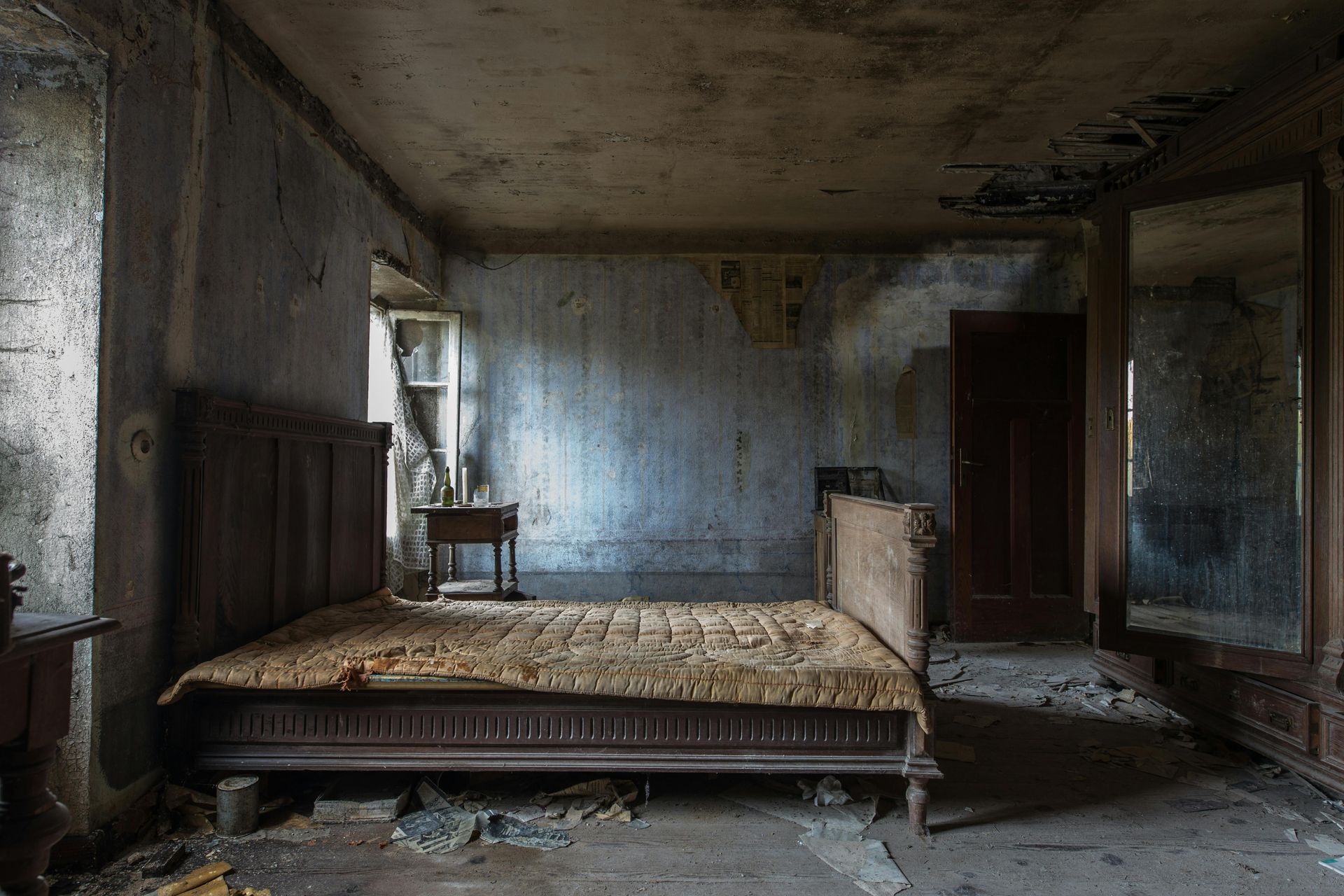 An image of a bed with white sheets and one brown pillow.