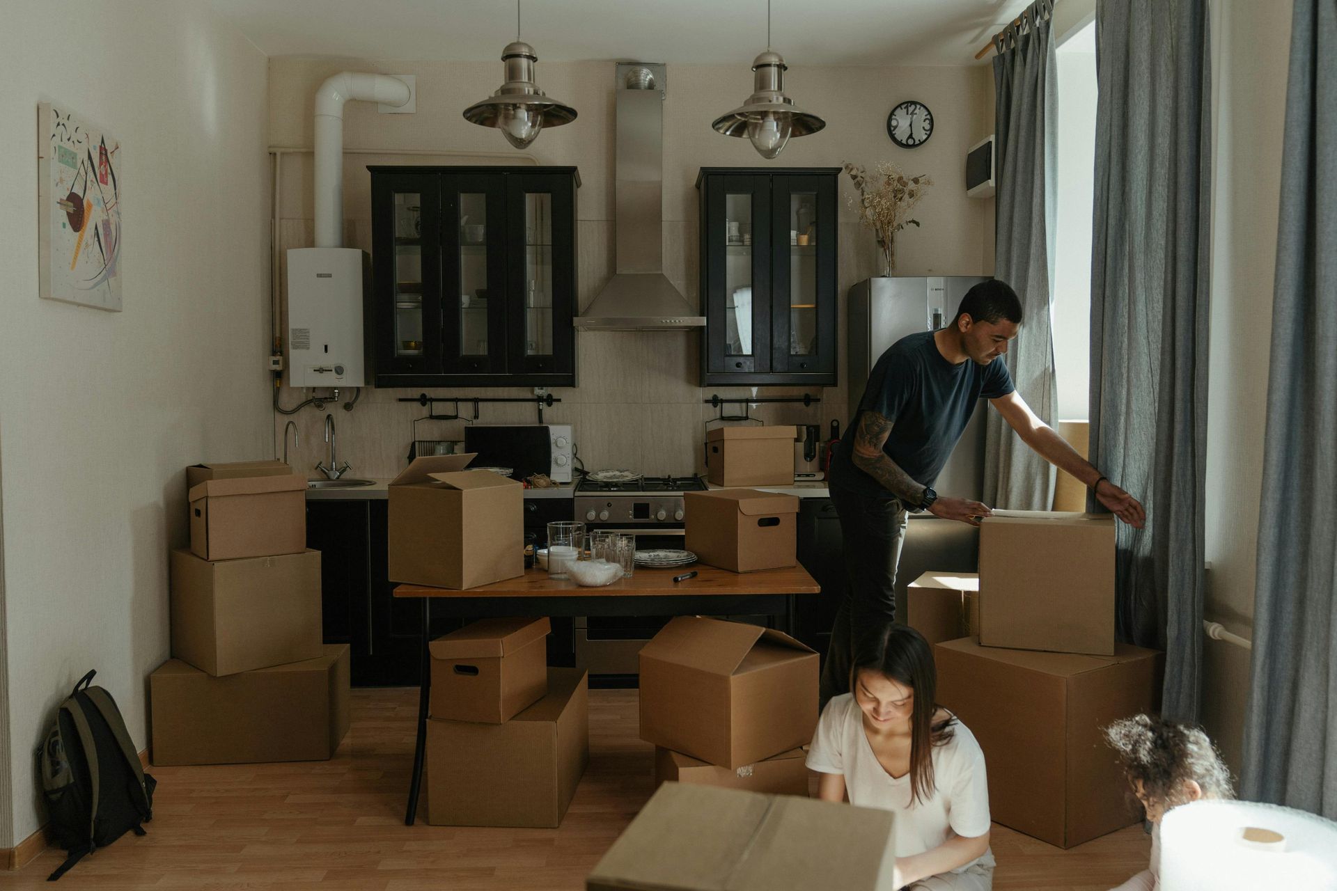 A person doing Furniture Relocation, moving a couch.
