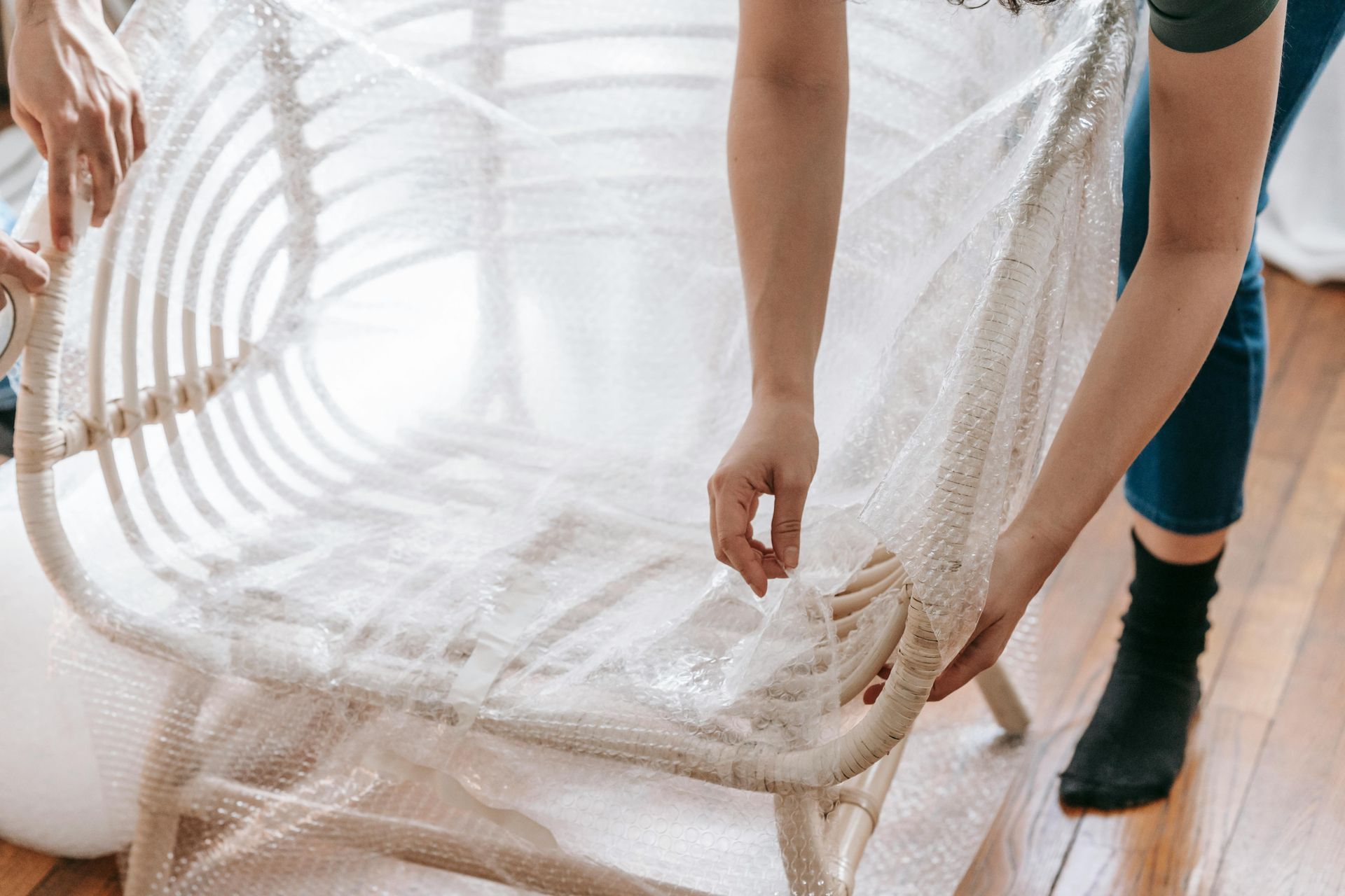 A wooden chair about to be wrapped with cloth.