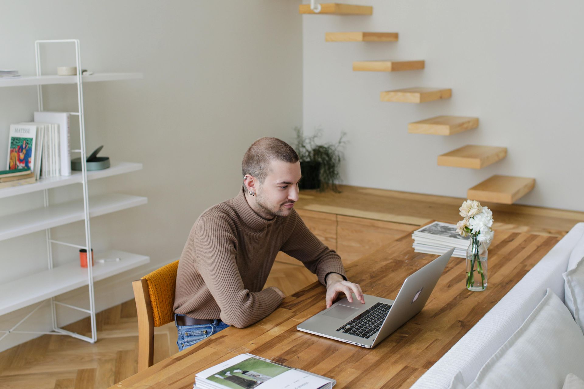 A cozy home office wall with a monitor and chair.