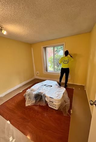Worker Painting the Wall of a Room — Portland, OR — Black Dreams Construction