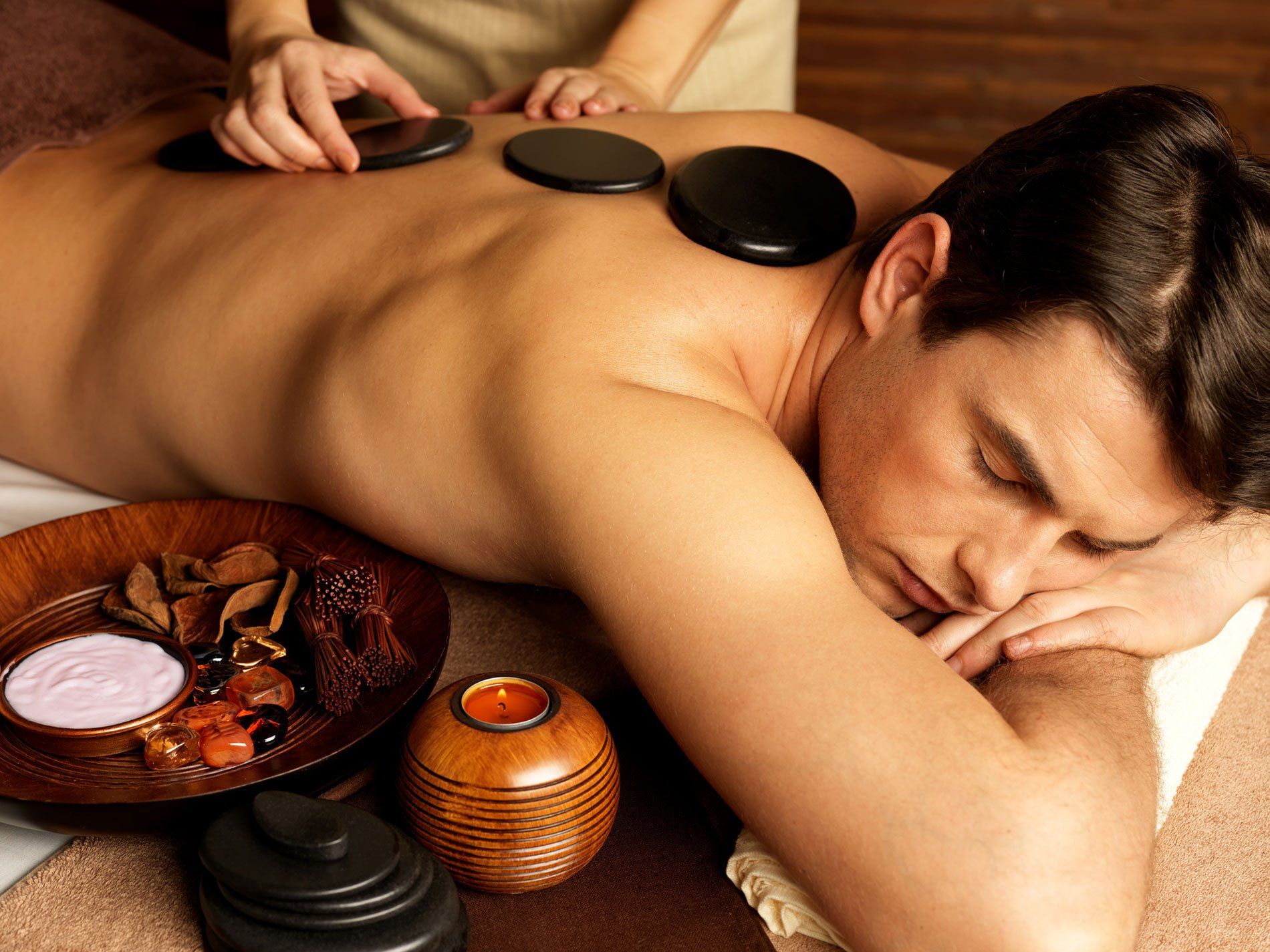 Person getting a hot stone massage