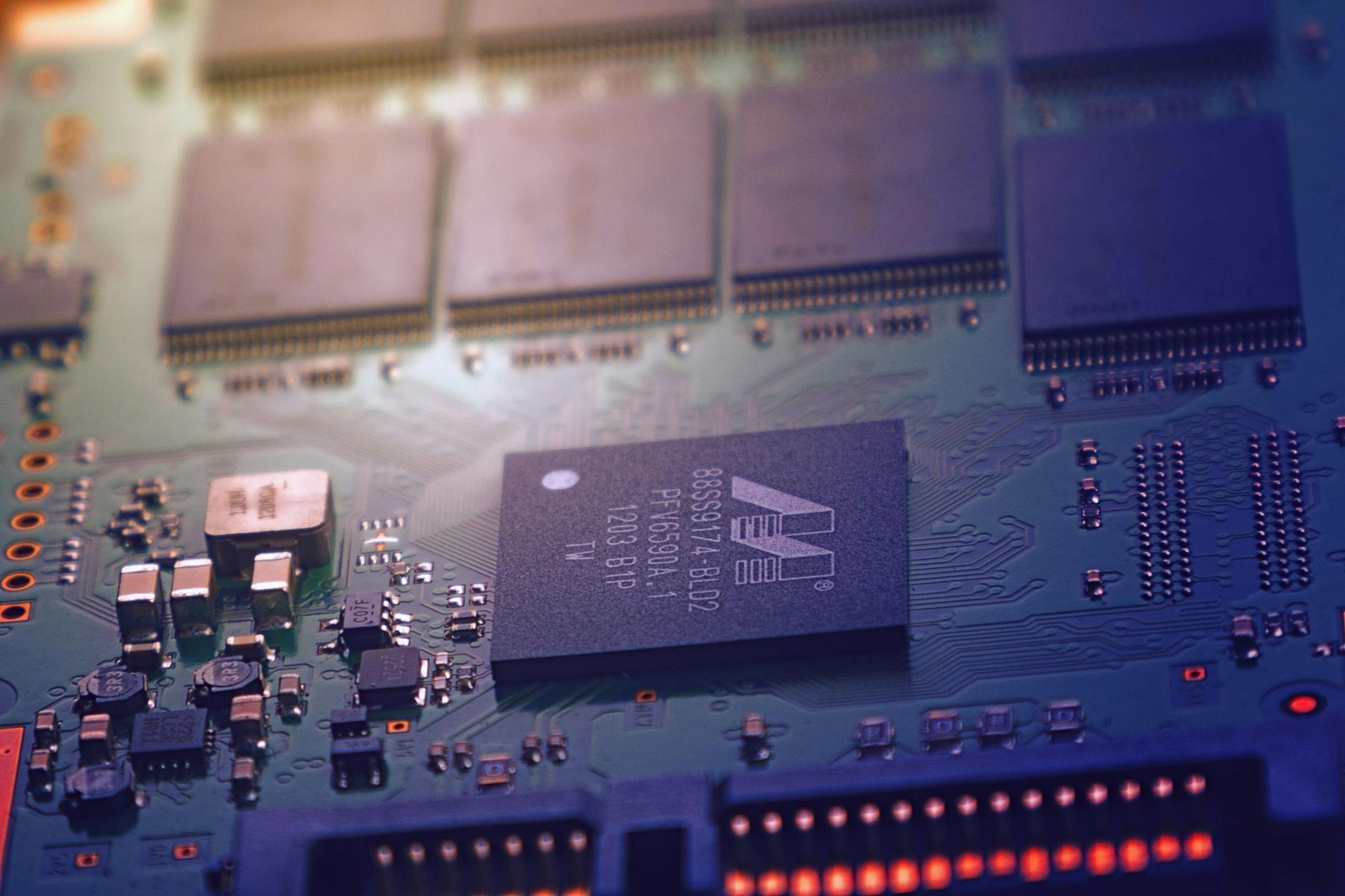 A close up of a computer motherboard with a chip on it.