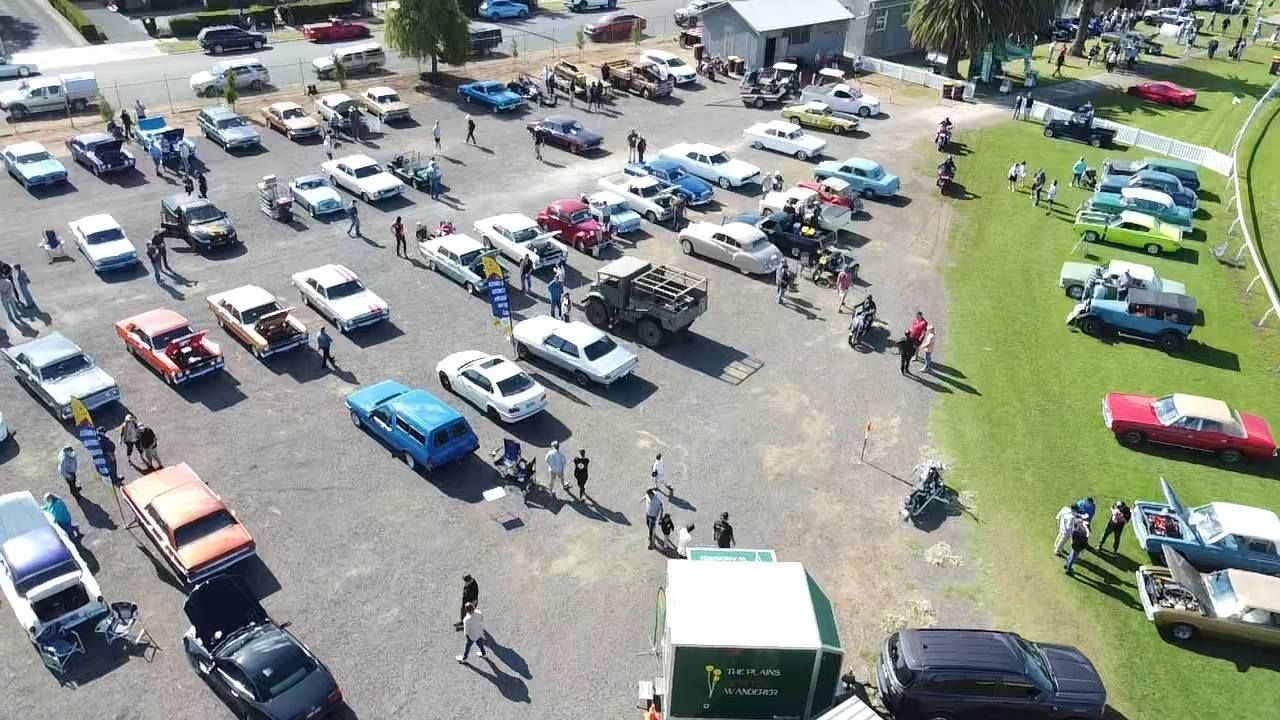 drone image with a birds eye view of parked cars