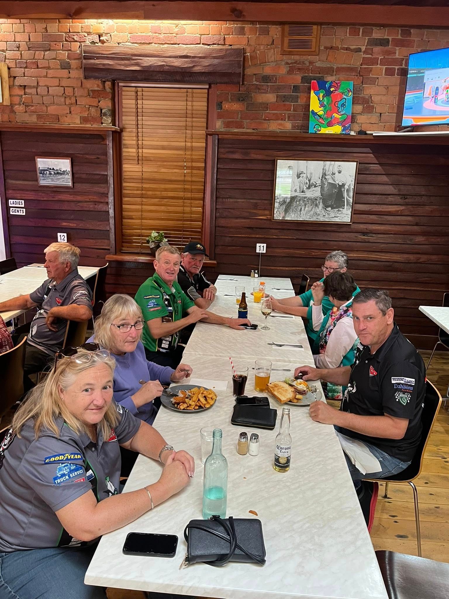 group of people sitting at a table 