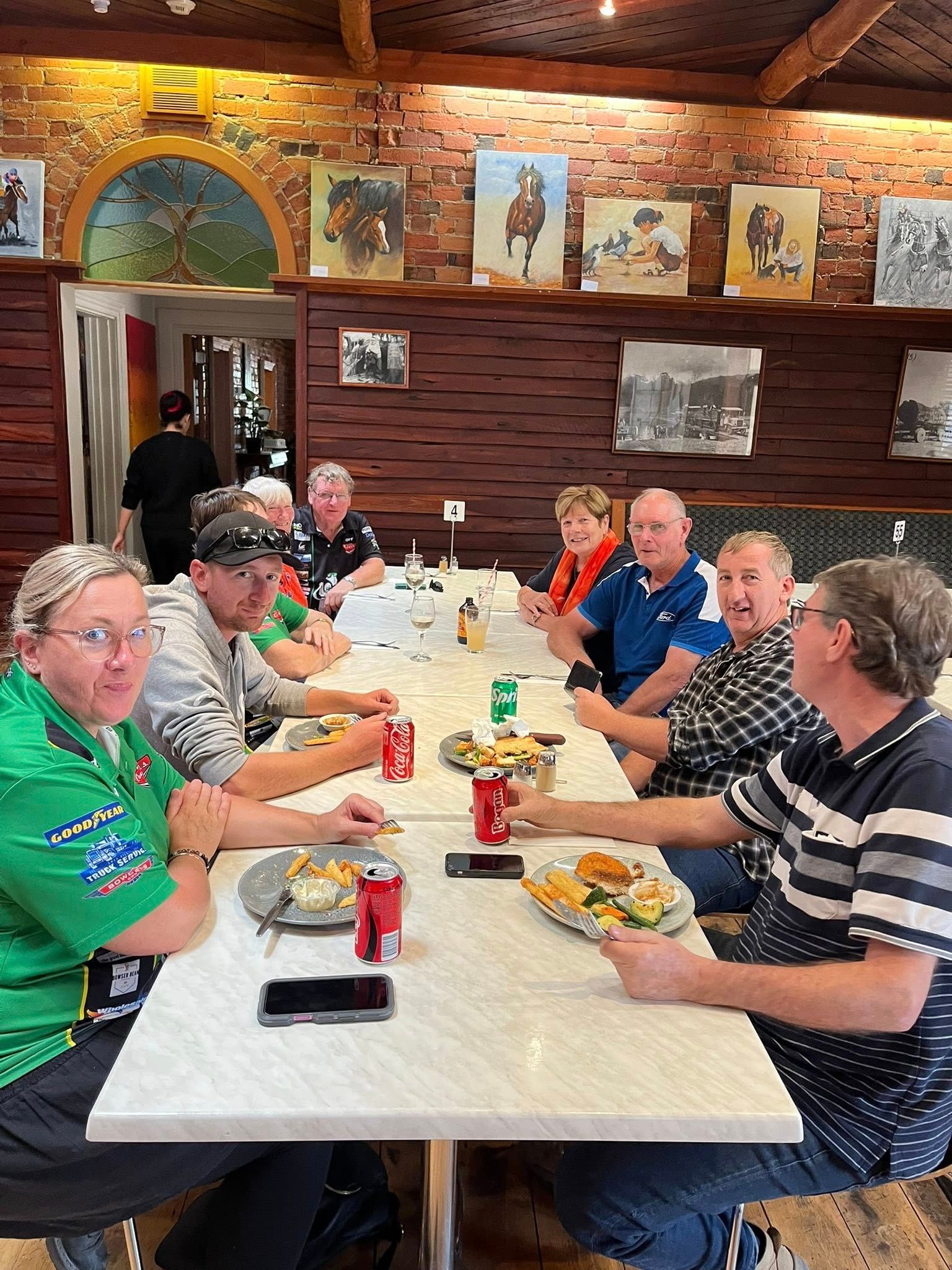 group of people sitting at a table 