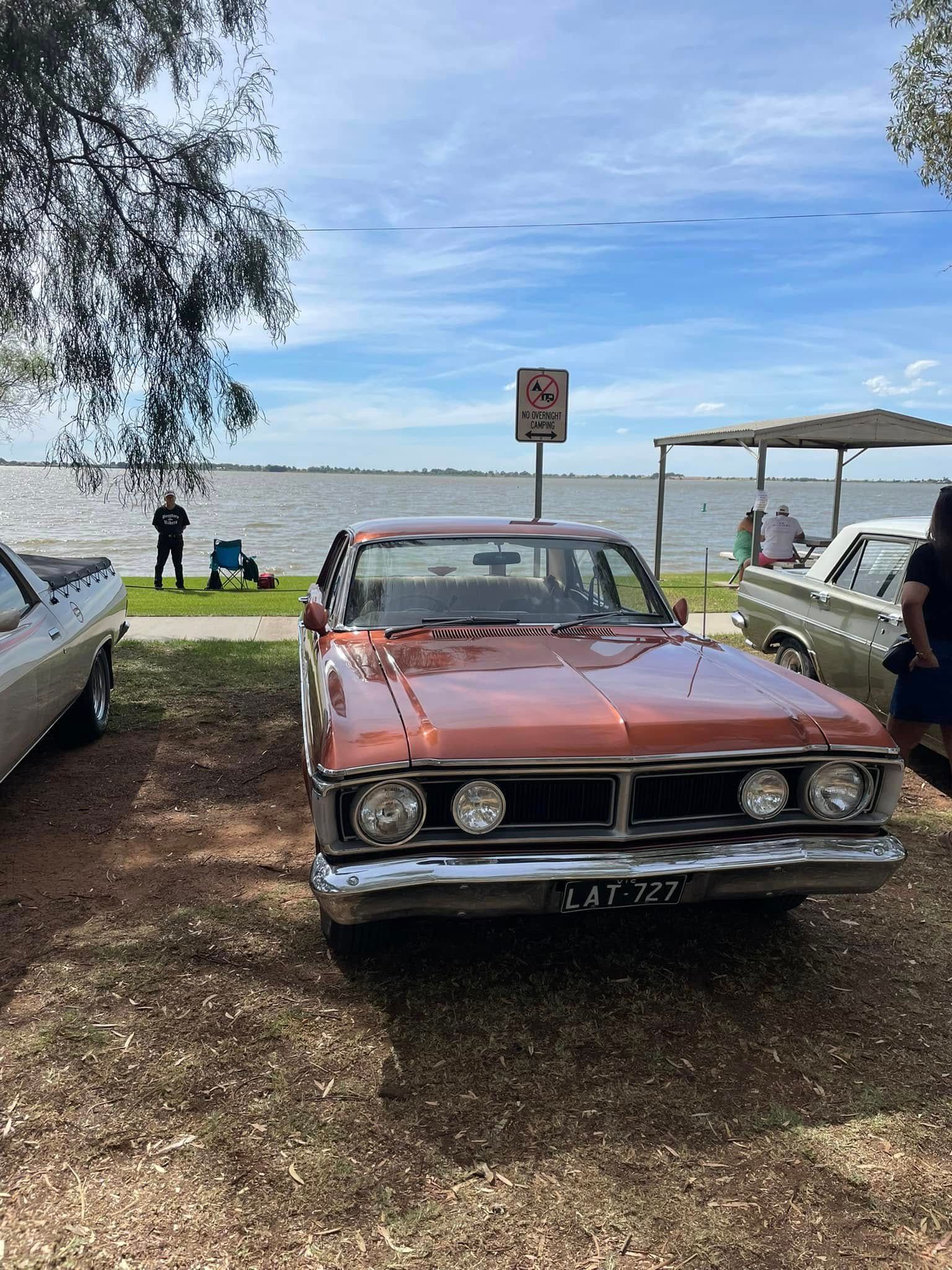 car parked on the foreshore of a lake