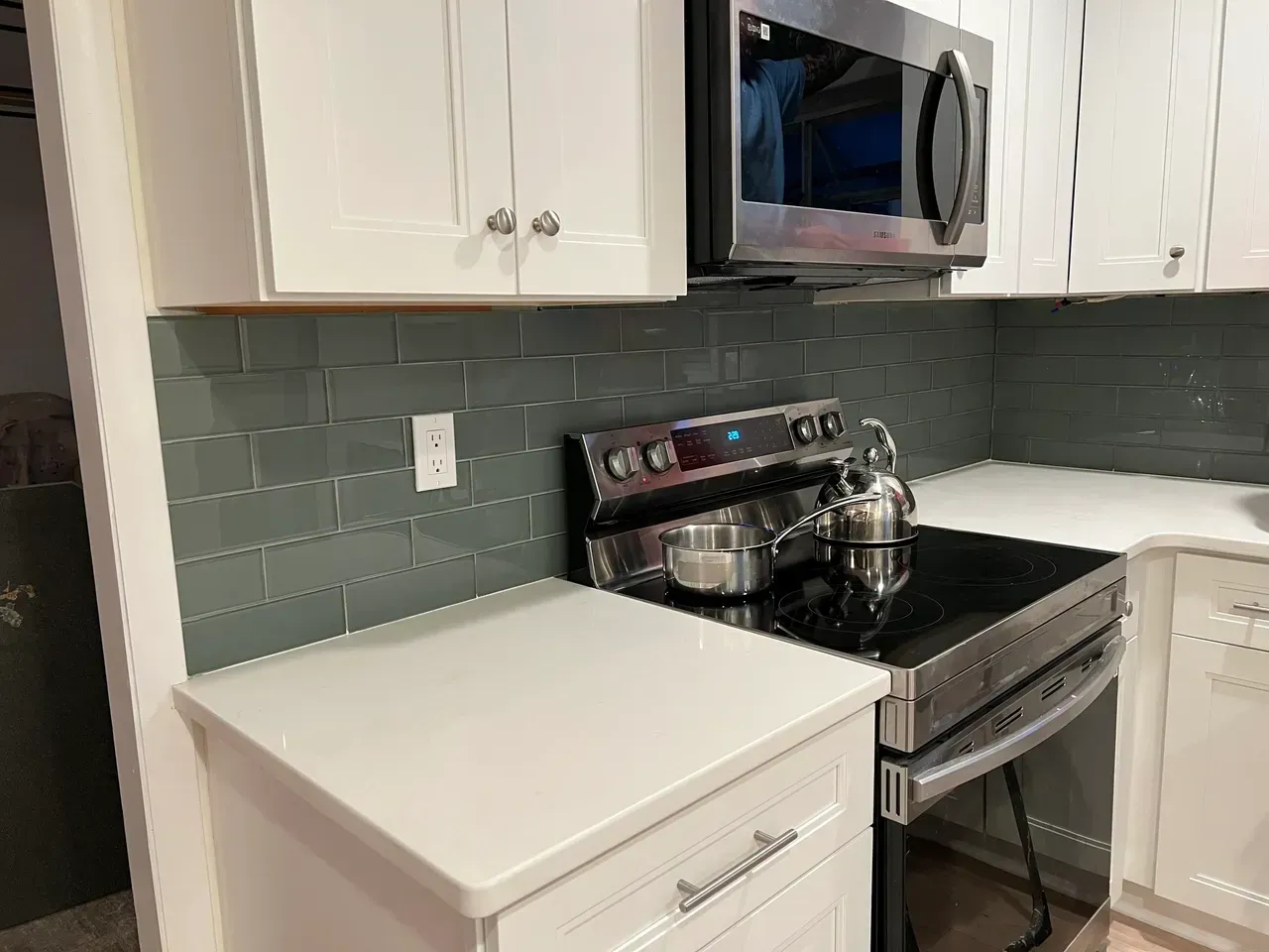 A kitchen with a stove , microwave , and dishwasher.