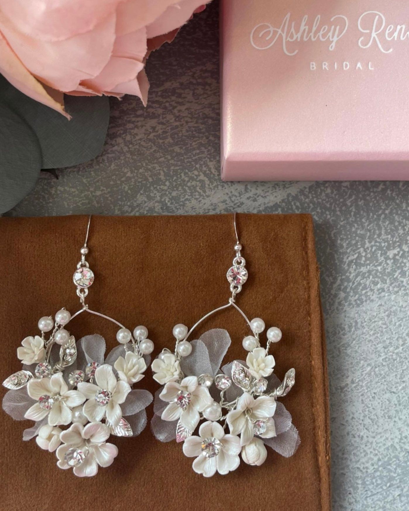 A pair of earrings made by ashley ren