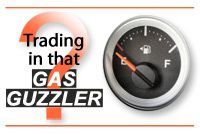 A gas gauge with the words `` trading in that gas guzzler '' next to it.