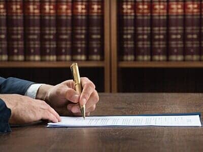 Attorney Writing in the form — Estate Planning in Naples, FL
