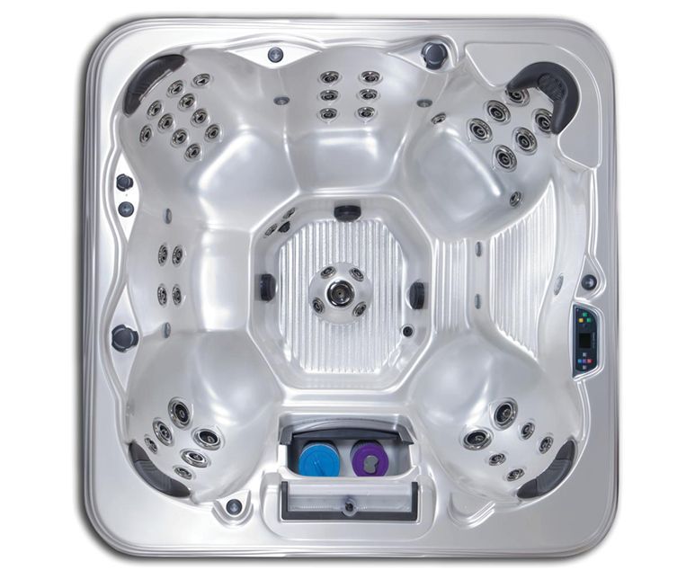 Overhead view of a silver, multi-person hot tub with various jet seating areas and controls.