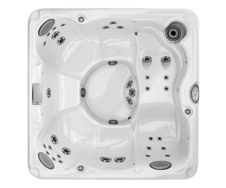 Overhead view of a white hot tub with multiple seating areas and water jets.