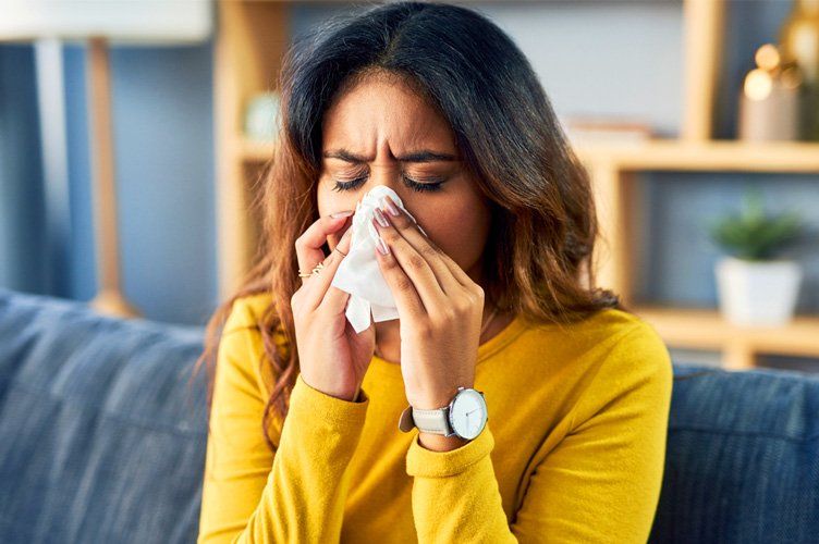 Young Woman blowing her nose
